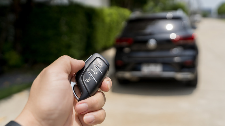 Person unlocks car with keys