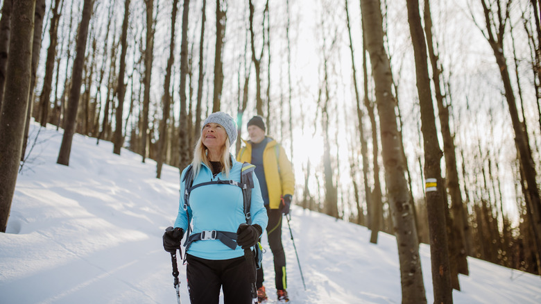 Couple hiking in snowy forest