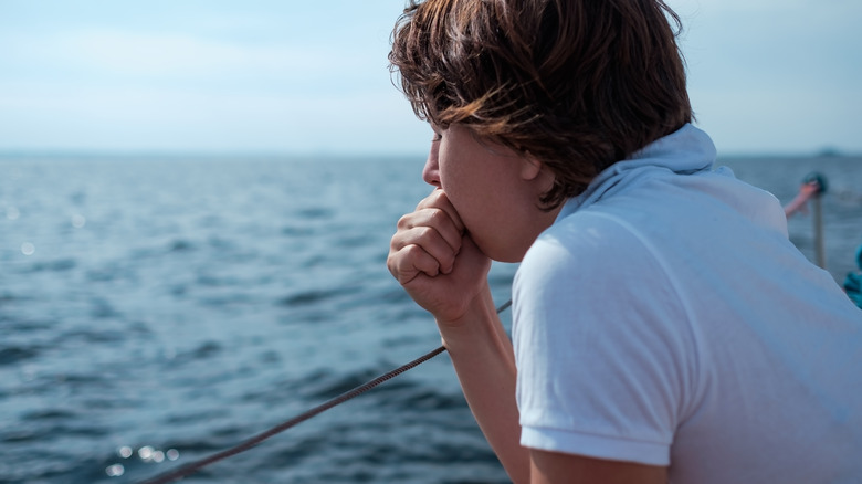 nauseous person on a ship 