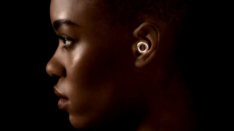A woman wearing Loop earplugs