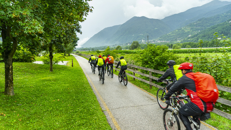Cyclists trek in rain along Valsugana Cycle Path