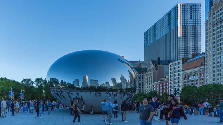 Chicago tourists gathered at Millennium Park in front of "The Bean"