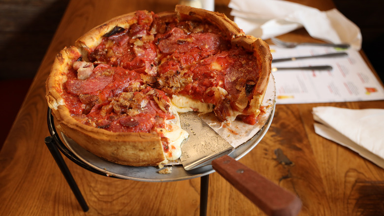 Deep-dish pizza on table