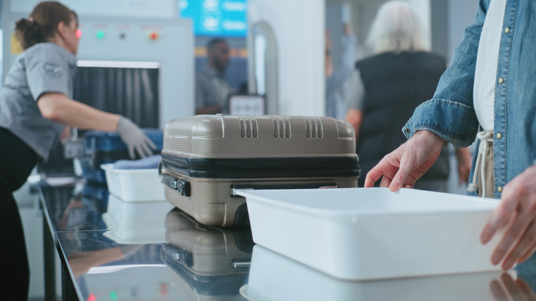 People going through the TSA checkpoint at the airport