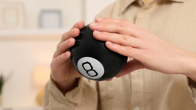 Person with a Magic 8 Ball
