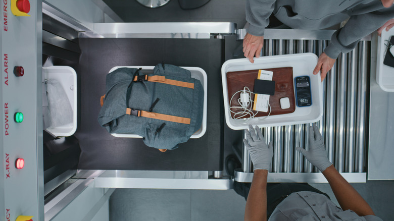 Personal belongings passing through TSA scanner