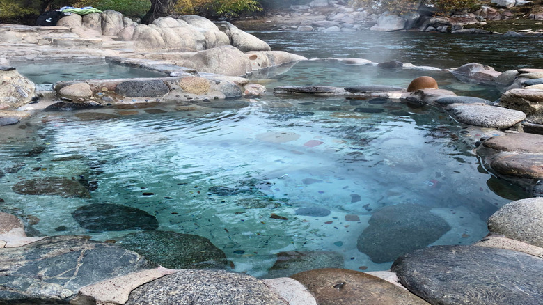 Three manmade hot springs built into the boulders overlook the Kern River at Remington Hot Springs, California