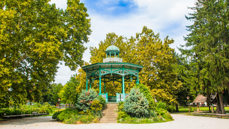 Intricately designed green pavilion in park