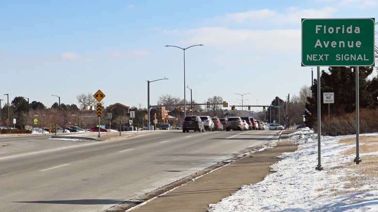 a road with card and snow in Four Square Miles, Colorado