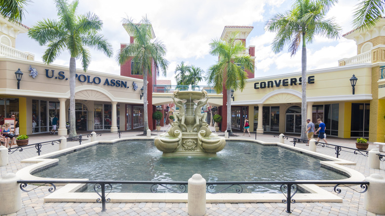Miromar Outlets with a few shoppers walking, Estero, Florida
