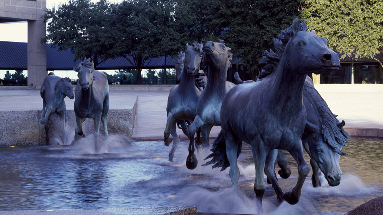 Mustang sculptures in an outdoor fountain