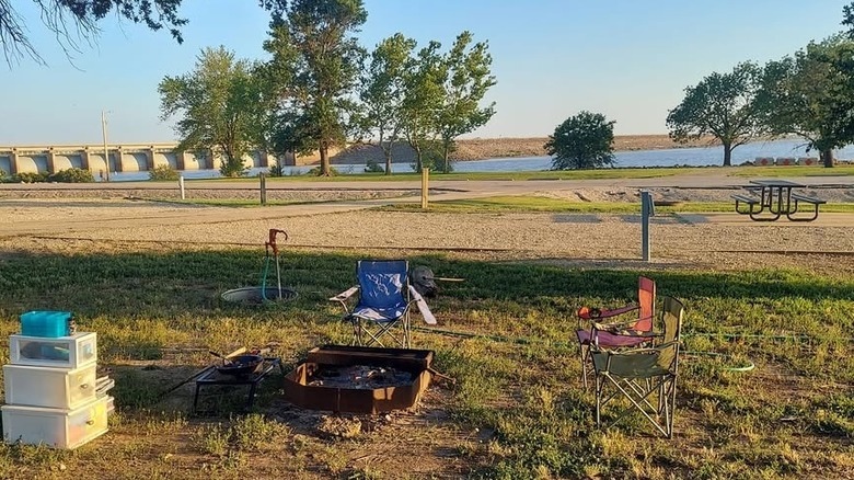 Fire pit and camping chairs next to the John Redmond Reservoir in Kansas
