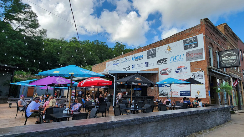 A photo of people seated on patio of Riverfront Bar and Grill in Peru, Illinois