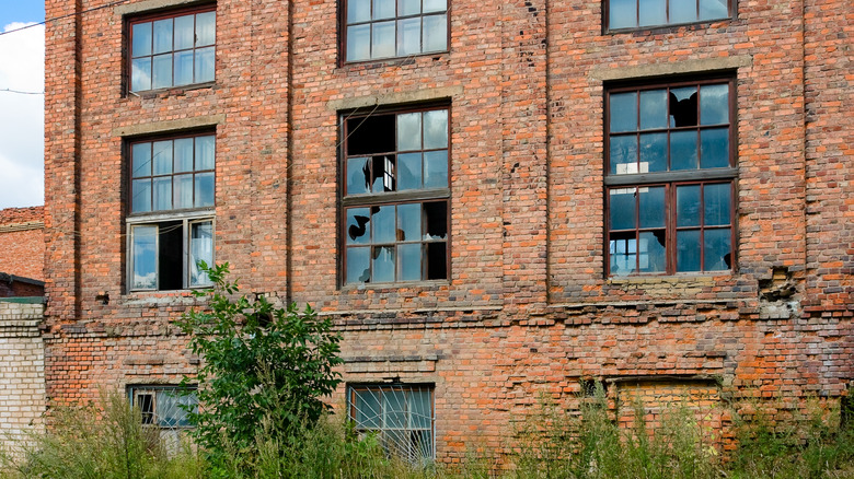 Broken windows of abandoned Byron Hot Springs Hotel