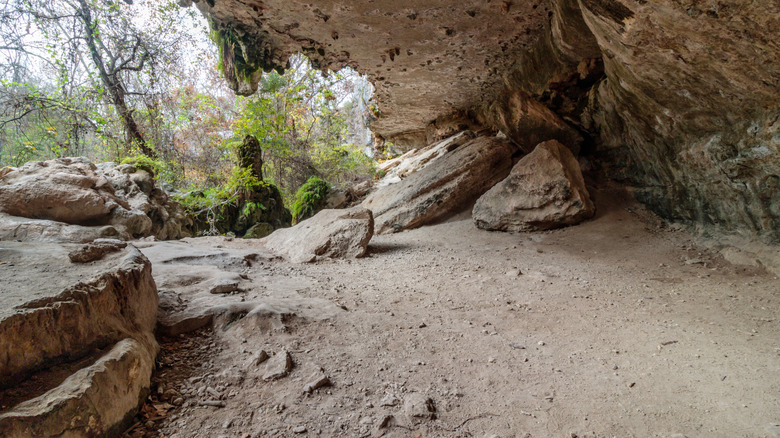 A hiking trail at Texas' Milton Reimers Ranch passing under a rocky outcrop