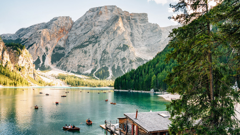 People rowing boats on Lago di Braies in the Dolomites