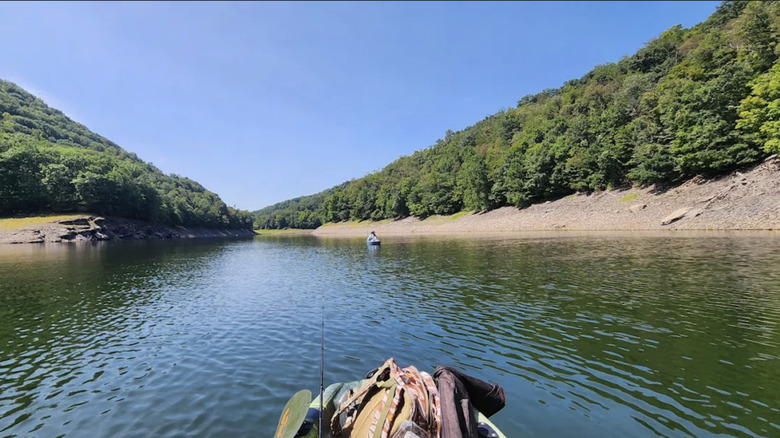 Two men fishing from kayaks on Savage River Reservoir