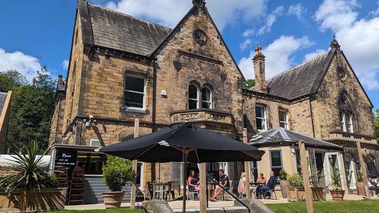Patrons sit and eat outside the historic Holmfield Arms Hotel