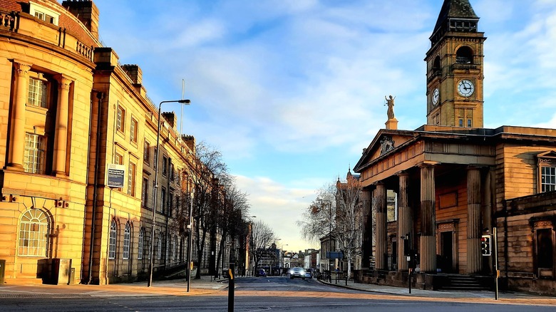 Historic buildings line a Wakefield street.
