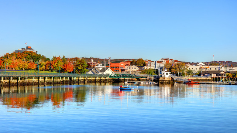 Colorful buildings and trees along water