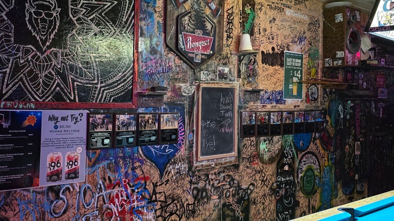 Graffitied wall and pool table Buffet Bar Tucson