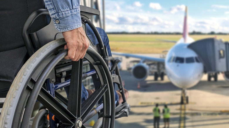 A traveler in a wheelchair waits to board a flight