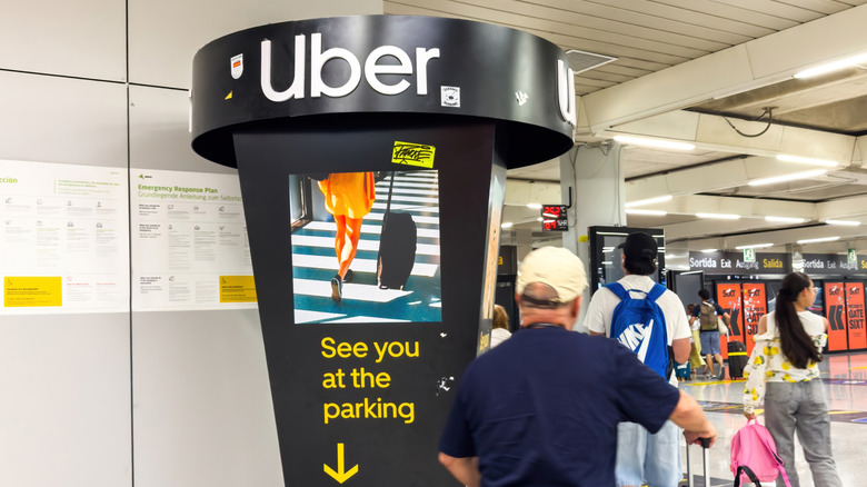 An Uber directional kiosk at an airport in Spain