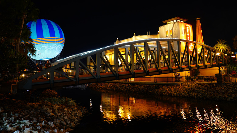 Night-time view of the hot-air ballon and bridge at Disney Springs, an admission-free entertainment district within Walt Disney World in Orlando, Florida, USA.