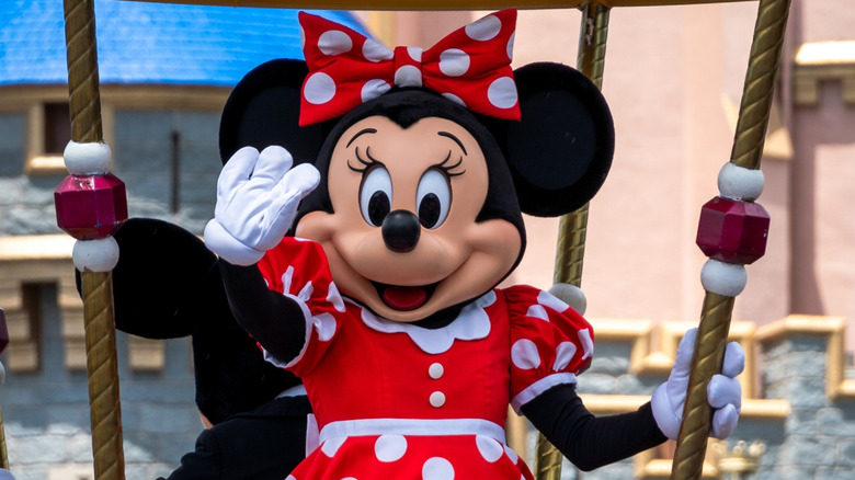 Close-up of Minnie Mouse character at Walt Disney World in Orlando, Florida, USA, waving