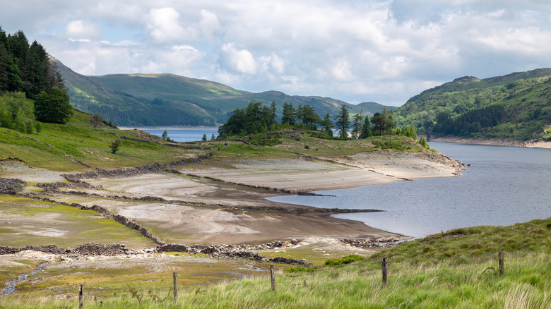 Mardale village ruins in Haweswater, Cumbria, on a cloudy day