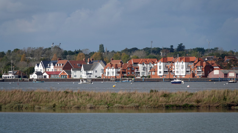 Sailing boats bobbing in front of houses in Burnham-on-Crouch, Essex
