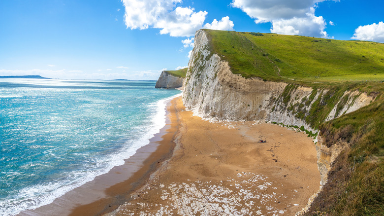 A view of the high cliffs that stretch out around Durdle Door in Dorset