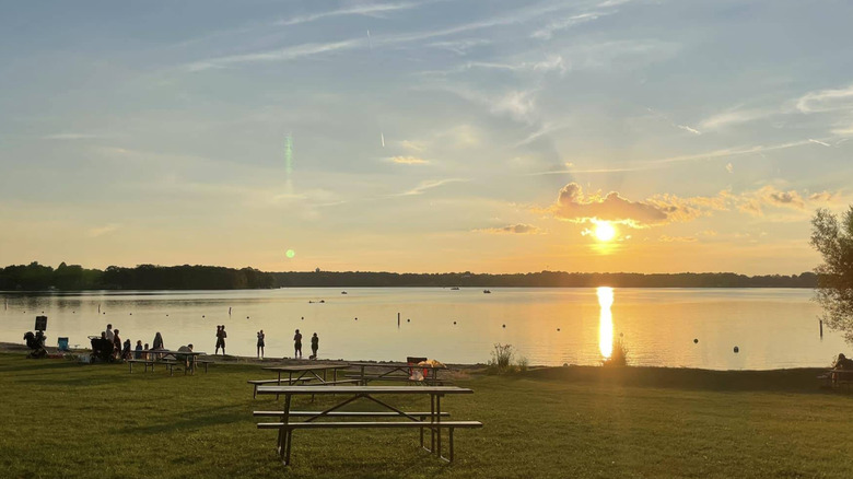 Visitors on Pike Lake Beach at sunset in the Kettle Moraine State Forest in Hartford, Wisconsin