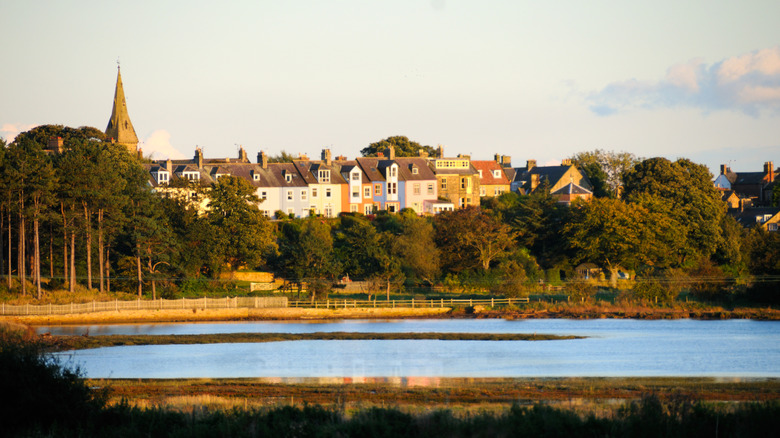 Sunset view of the colorful terrace houses facing calm waters