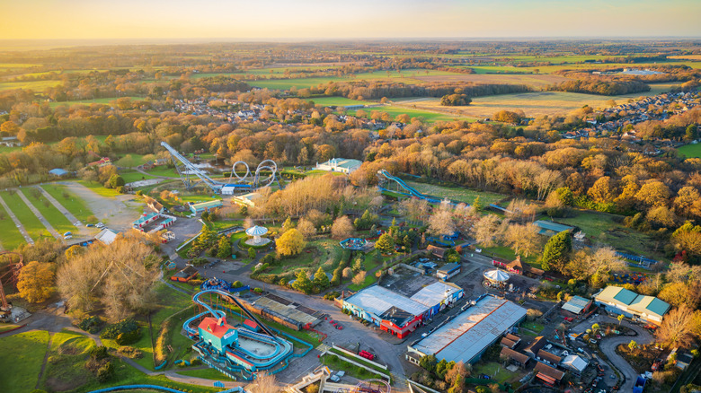 Pleasurewood Hills and its various rides and ground level attractions during sunset in Lowestoft, UK