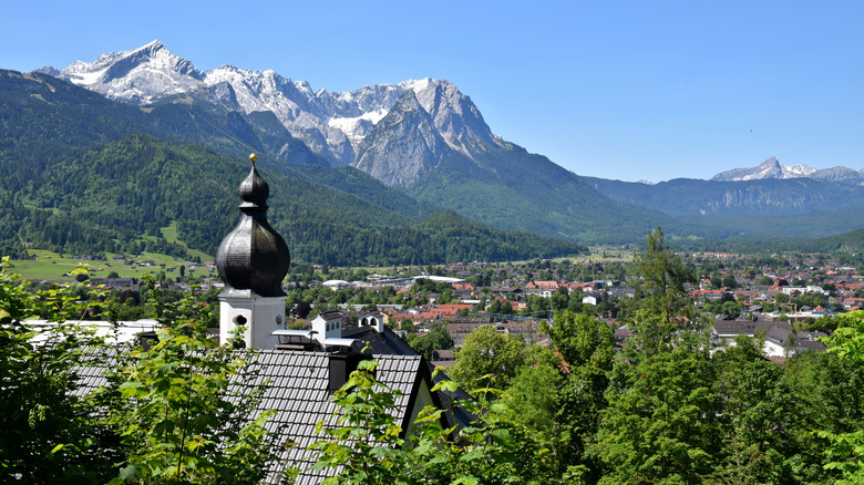 A church dome rises beneath the Alps in Garmisch-Partenkirchen