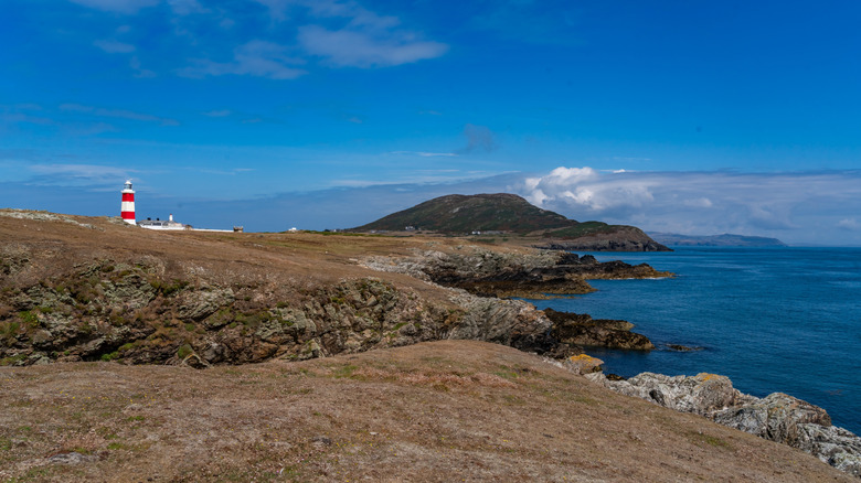 The Bardsey Lighthouse near the coastline on Bardsey Island, off the Llyn Peninsula in North Wales