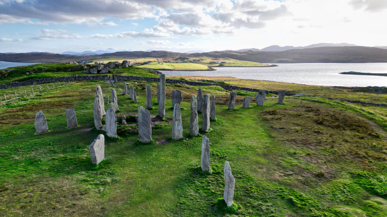 The ancient standing stones of Calanais on Lewis in the Outer Hebrides of Scotland at sunset