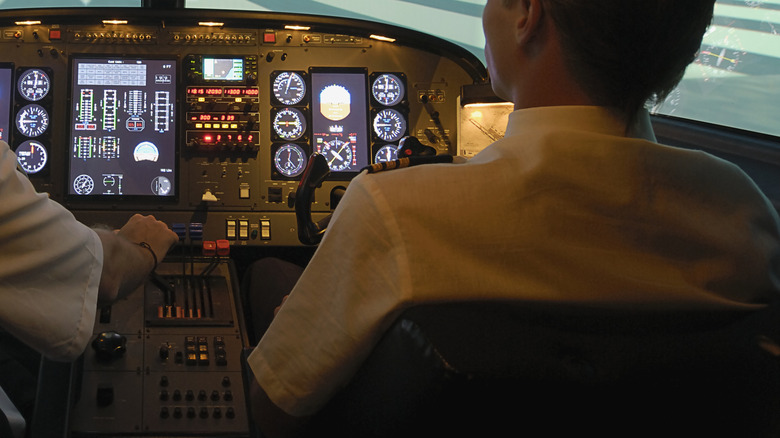 Two pilots sitting in the cockpit