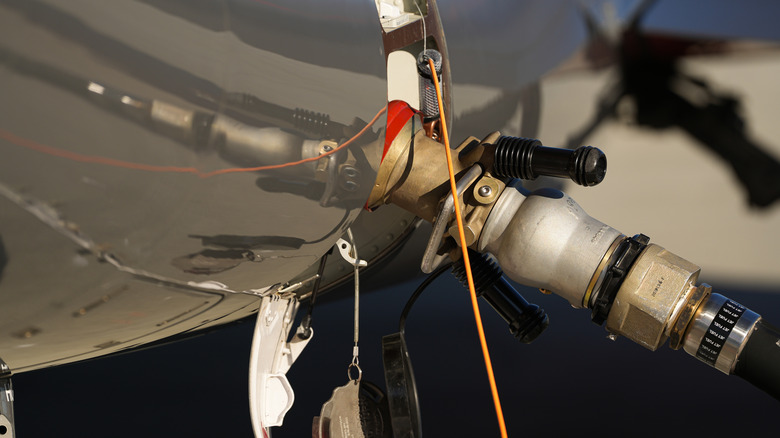 A plane being refueled on the runway