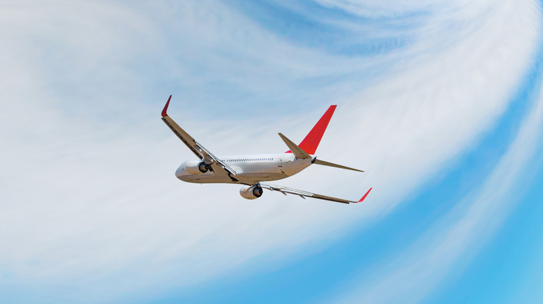 A plane flying through turbulence in the sky