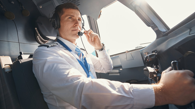 Pilot talking into his headset