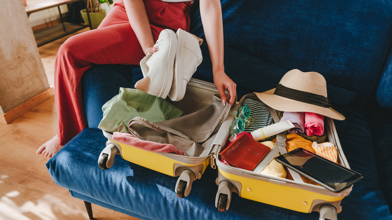 Woman packing carry-on bag