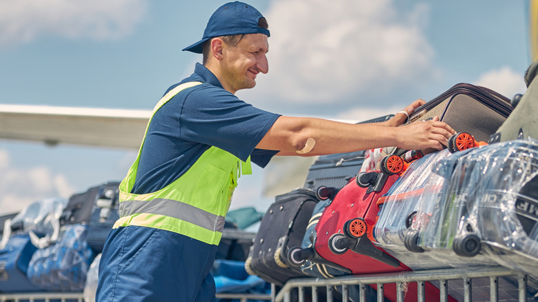 Baggage handler with suitcases
