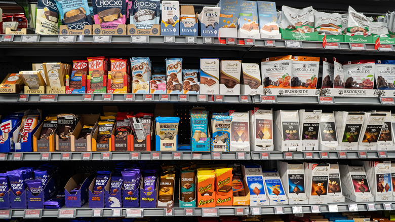 View of assorted chocolate bars and boxed chocolates on supermarket shelves in Toronto
