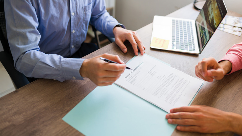 Person signing a contract