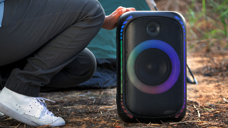 Camper setting up big speaker
