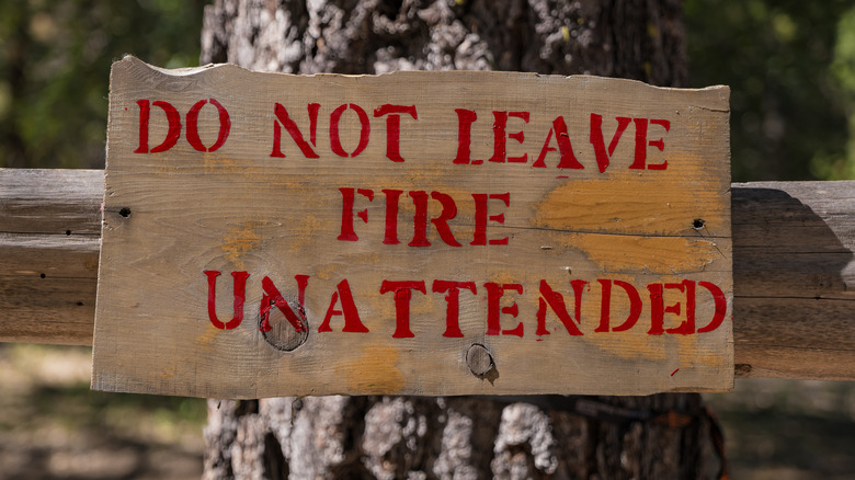 A sign in the Sierra Nevada region that reads "Do not leave fire unattended"