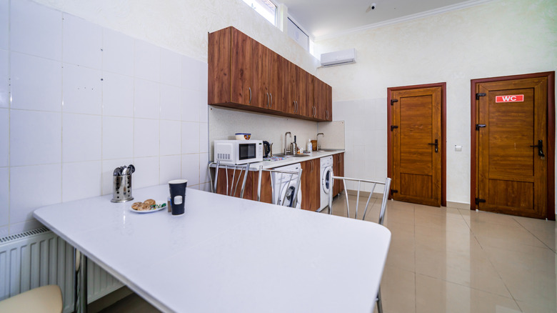 Common dining room in hostel with table