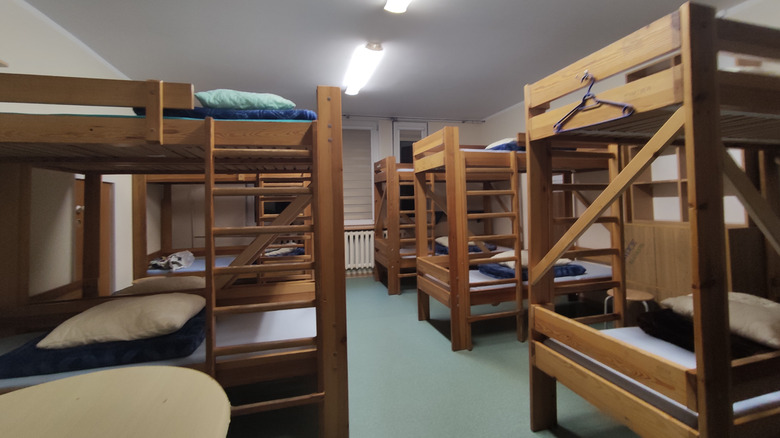 Hostel dorm with wooden bunk beds